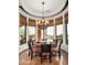 Charming breakfast nook with views of the desert landscape and an elegant chandelier at 11548 E Salero Dr, Scottsdale, AZ 85262