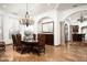 Elegant dining room featuring a chandelier and a large window, perfect for entertaining guests at 11548 E Salero Dr, Scottsdale, AZ 85262