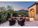 Outdoor fire pit with comfortable seating, surrounded by lush landscaping and offering a relaxing ambiance at 11548 E Salero Dr, Scottsdale, AZ 85262