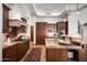 Chef's kitchen featuring custom cabinets, granite countertops, and high-end stainless steel appliances at 11548 E Salero Dr, Scottsdale, AZ 85262