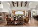 Bright living room features a stone fireplace, beamed ceilings and a huge window with expansive views at 11548 E Salero Dr, Scottsdale, AZ 85262