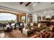 Comfortable living room showcases access to the kitchen, view to the outside and neutral color palette at 11548 E Salero Dr, Scottsdale, AZ 85262