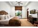 Serene main bedroom with a king-size bed, wood accents, and a private outdoor patio at 11548 E Salero Dr, Scottsdale, AZ 85262