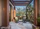 Outdoor patio with pergola, seating, desert views, and desert landscaping at 11548 E Salero Dr, Scottsdale, AZ 85262
