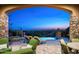 Covered patio featuring an inviting pool area and comfortable lounge seating, perfect for enjoying the desert sunset at 11548 E Salero Dr, Scottsdale, AZ 85262