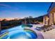 Evening view of the pool and spa area, showcasing desert scenery and inviting lounge chairs at 11548 E Salero Dr, Scottsdale, AZ 85262