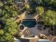 Aerial shot showcasing a large pool, spa, and patio area with lounge furniture at 11548 E Salero Dr, Scottsdale, AZ 85262