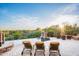 Breathtaking sunset view from the pool area, complemented by elegant lounge chairs and desert landscape at 11548 E Salero Dr, Scottsdale, AZ 85262