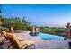 Scenic backyard with a pool, spa, desert landscaping, and patio furniture for outdoor enjoyment at 11548 E Salero Dr, Scottsdale, AZ 85262