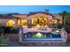 Stunning outdoor pool and spa with stone accents, perfect for relaxing and entertaining in a luxurious backyard setting at 11548 E Salero Dr, Scottsdale, AZ 85262