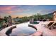 Outdoor entertaining space with spa and pool overlooking desert and fire pit at 11548 E Salero Dr, Scottsdale, AZ 85262