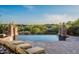 Relaxing poolside view overlooking lush greenery and hills, with comfortable lounge chairs for leisure at 11548 E Salero Dr, Scottsdale, AZ 85262