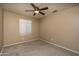 Carpeted bedroom featuring ceiling fan, light fixtures, neutral walls and one window at 12044 S 45Th St, Phoenix, AZ 85044