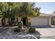 Charming single story home with a well maintained front yard, mature trees and two car garage at 12044 S 45Th St, Phoenix, AZ 85044