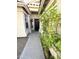 Home's front entrance featuring a security door, textured wall, and plants at 12044 S 45Th St, Phoenix, AZ 85044