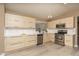 Modern kitchen features stainless steel appliances, sleek cabinets, white countertops and vinyl flooring at 12044 S 45Th St, Phoenix, AZ 85044