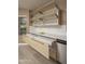 Kitchen featuring modern, light wood cabinets and drawers, stainless steel appliances, and white countertops at 12044 S 45Th St, Phoenix, AZ 85044