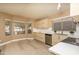 Modern kitchen features stainless steel appliances, sleek cabinets, white countertops and vinyl flooring at 12044 S 45Th St, Phoenix, AZ 85044