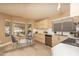 Eat in kitchen boasts modern cabinetry, stainless appliances, white countertops, and lots of natural light at 12044 S 45Th St, Phoenix, AZ 85044