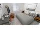 Cozy bedroom with neutral tones, a desk, and soft natural light at 12633 W Luxton Ln, Avondale, AZ 85323