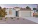 Charming single-story home featuring a neutral color palette, tile roof, and a low-maintenance gravel yard at 12633 W Luxton Ln, Avondale, AZ 85323