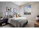 Comfortable bedroom with large window, baseball-themed decor, and a soft, inviting bed at 12647 W Parkway Ln, Avondale, AZ 85323
