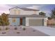 Charming two-story home with a two car garage, landscaped front yard, and covered entryway at 12647 W Parkway Ln, Avondale, AZ 85323