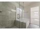 Modern bathroom showcases marble tiled shower with glass door, and soaking tub near window at 15360 N 87Th Ave, Peoria, AZ 85381