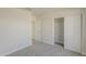 Bright bedroom features neutral carpet, closet with sliding doors and door that leads to another room at 15360 N 87Th Ave, Peoria, AZ 85381