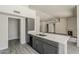 Modern kitchen with gray cabinetry and marble countertops at 15360 N 87Th Ave, Peoria, AZ 85381