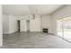 Spacious living room featuring tile floors, ceiling fan, and fireplace at 15360 N 87Th Ave, Peoria, AZ 85381