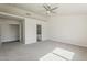 Spacious main bedroom with walk-in closet, ceiling fan, and ensuite bathroom at 15360 N 87Th Ave, Peoria, AZ 85381
