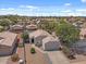 Panoramic aerial view of a residential neighborhood featuring well-kept homes, mature trees, and desert landscaping at 1703 E Palo Blanco Way, Gilbert, AZ 85296