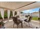 Serene backyard featuring an outdoor dining area and lush greenery, perfect for entertaining at 1703 E Palo Blanco Way, Gilbert, AZ 85296