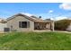 Expansive backyard with a well-maintained lawn and covered patio, perfect for outdoor living at 1703 E Palo Blanco Way, Gilbert, AZ 85296