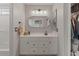 Charming bathroom with white cabinets, framed mirror, and shower at 1703 E Palo Blanco Way, Gilbert, AZ 85296