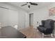 Comfortable bedroom with large chair, carpet, and sliding door closet at 1703 E Palo Blanco Way, Gilbert, AZ 85296