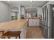 Bright kitchen boasts stainless steel appliances, a center island, and plenty of cabinet space at 1703 E Palo Blanco Way, Gilbert, AZ 85296