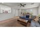 Cozy living room features tile flooring, neutral paint, and a comfortable sofa with stylish throw pillows and decor at 1703 E Palo Blanco Way, Gilbert, AZ 85296