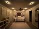 Modern bedroom with neutral color palette, carpet, ceiling fan, and decorative artwork on the walls at 1703 E Palo Blanco Way, Gilbert, AZ 85296