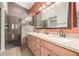 Bathroom features a double sink vanity, granite countertops, and tiled shower at 18080 W Spencer Dr, Surprise, AZ 85374