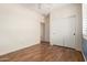 An additional bedroom includes wood floors, and a bright window at 18080 W Spencer Dr, Surprise, AZ 85374