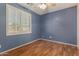 Empty bedroom with window and ceiling fan offers a blank canvas to create your perfect sanctuary at 18080 W Spencer Dr, Surprise, AZ 85374