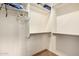 Bright and spacious walk-in closet with shelves and hanging rods for maximum storage at 18080 W Spencer Dr, Surprise, AZ 85374