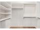 Walk-in closet with custom shelving and plenty of storage space at 18080 W Spencer Dr, Surprise, AZ 85374