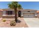 Charming single-Gathering home with desert landscaping and an attached two-car garage at 18080 W Spencer Dr, Surprise, AZ 85374