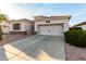 Charming single-Gathering home featuring a two-car garage, driveway, and well-kept landscaping at 18080 W Spencer Dr, Surprise, AZ 85374