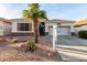 Charming single-story home with mature landscaping and a two-car garage at 18080 W Spencer Dr, Surprise, AZ 85374
