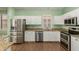 Bright kitchen featuring stainless steel appliances, white cabinets, and granite countertops at 18080 W Spencer Dr, Surprise, AZ 85374