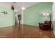 Inviting living room with a comfortable recliner and great lighting at 18080 W Spencer Dr, Surprise, AZ 85374